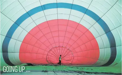  ?? Picture: Reuters ?? A man prepares to inflate a hot air balloon in Pokhara, Nepal, yesterday.