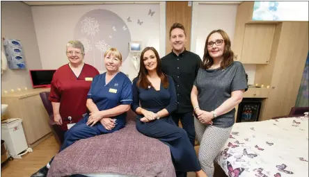  ??  ?? Lead Midwife Dorothy Finlay, Senior Charge Midwife Jacqueline Crawford, Lisa, Kris and Sara Fitzsimmon­s, CEO of SiMBA, in the special family room Picture: Robert Perry