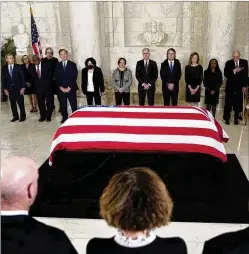  ?? JACQUELYN MARTIN/ASSOCIATED PRESS ?? With family members in the foreground, current and former members of the Supreme Court take their places by the flag-draped casket of retired Justice Sandra Day O’connor, who died Dec. 1 at 93. Mourners at the court Monday also included Vice President Kamala Harris.