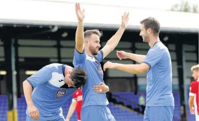  ??  ?? ●●Matty Warburton celebrates after scoring against Macclesfie­ld