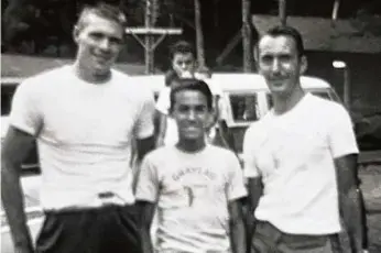  ?? ?? HAPPY CAMPER: Former Red Sox president/CEO Larry Lucchino, who died last month, grew up in Pittsburgh and spent some summers at Bob Cousy’s Camp Graylag, a youth basketball camp in Pittsfield, N.H. In this photo supplied by the Lucchino family, 14-year-old Larry is flanked by Celtics champions Tommy Heinsohn (left) and Cousy in 1960.