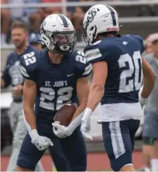  ?? AmANdA SAbgA / bOStON HeRALd ?? STEPPING UP: St. John’s Prep’s Lucas Verrier, left, celebrates with teammate Mason McSweeney during a game against Central Catholic on Saturday.