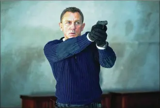  ?? NICOLA DOVE / DANJAQ LLC / MGM ?? Daniel Craig stars as James Bond in “No Time to Die.”