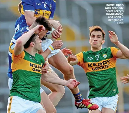  ?? INPHO ?? Battle: Tipp’s Jack Kennedy beats Kerry’s David Moran and Brian Ó Beaglaoich