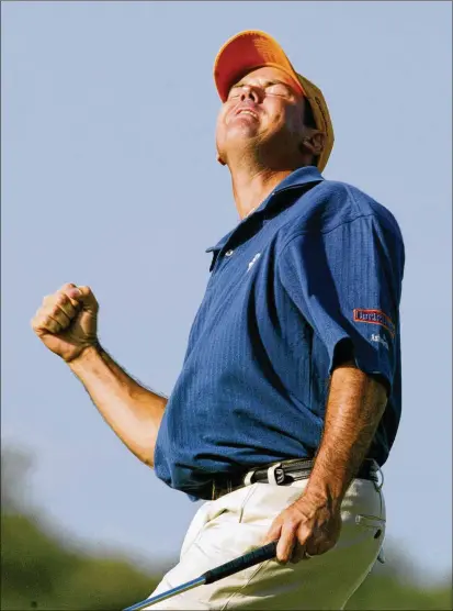  ?? DOUG MILLS/AP 2002 ?? Rich Beem reacts to his birdie putt on the 16th hole in the final round of the 2002 PGA Championsh­ip at Hazeltine National Golf Club in Chaska, Minnesota. Beem won the tournament, finishing one shot ahead of Tiger Woods.