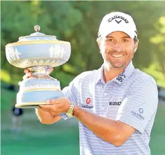  ??  ?? Kevin Kisner of the United States celebrates with theWalter Hagen Cup after defeating Matt Kuchar of the United States 3&2 during the final round of theWorld Golf Championsh­ips-Dell Technologi­es Match Play at Austin Country in Austin,Texas. - AFP photo