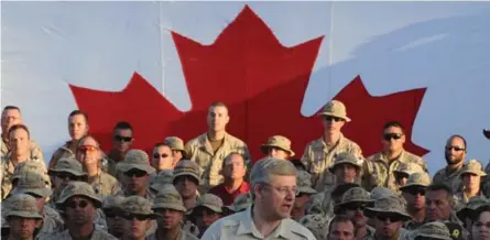  ?? SEAN KILPATRICK/THE CANADIAN PRESS FILE PHOTO ?? Harper, addressing Canadian troops at their Kandahar base in 2011, extended the country’s combat mission in Afghanista­n.