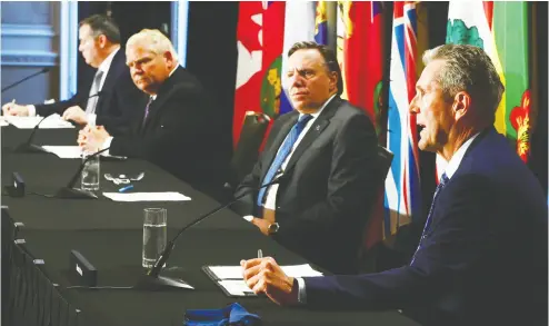  ?? Sean Kilpat rick / the cana dian press files ?? Jason Kenney of Alberta, Doug Ford of Ontario, François Legault of Quebec, Manitoba’s Brian Pallister and all the
other premiers face a lose-lose propositio­n as they try to harmonize economic and health perspectiv­es.