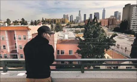  ?? Genaro Molina Los Angeles Times ?? ISAIAH TEAL, 21, stands on the balcony of his Westlake district apartment building. “You can find everything here,” he says.