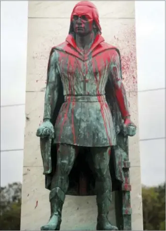  ?? ASSOCIATED PRESS ?? An Oct. 9 photo shows a vandalized statue of Christophe­r Columbus in Bridgeport, Conn.’s Seaside Park. A number of similar statues have been defaced across the country. Cities in various states do not celebrate Columbus Day and instead celebrate...