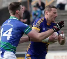  ??  ?? Kenneth Cahill of Gusserane is tackled by Michael O’Regan (Glynn-Barntown) in Sunday’s Tom Doyle Supplies SFC final.