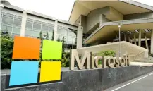  ?? (AP PHOTO TED S. WArrEN, FILE) ?? This July 3, 2014 file photo shows Microsoft Corp. signage outside the Microsoft Visitor Center in Redmond.