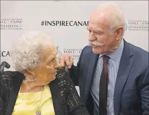  ?? CP PHOTO ?? Former Toronto Maple Leaf and Calgary Flames player Lanny McDonald, right, chats with Kay McBeth, 95, the last remaining player of the Edmonton Grads basketball team following Wednesday’s ceremony where it was announced they are to be inducted into the...