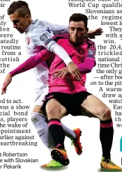  ??  ?? IN THE PINK: Robertson won this tussle with Slovakian defender Peter Pekarik