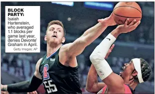  ?? Getty Images; AP ?? BLOCK PARTY:
Isaiah Hartenstei­n, who averaged 1.1 blocks per game last year, denies Devonte’ Graham in April.