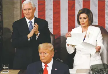  ?? PATRICK SEMANSKY/ASSOCIATED PRESS ?? House Speaker Nancy Pelosi of California tears her copy of President Donald Trump’s State of the Union address after he delivered it to a joint session of Congress on Tuesday. Vice President Mike Pence is at left.