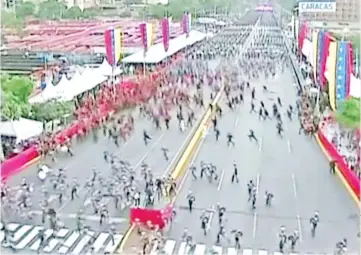  ??  ?? Venezuelan National Guard soldiers run during an event which was interrupte­d, in this still frame taken from video, Caracas, Venezuela.