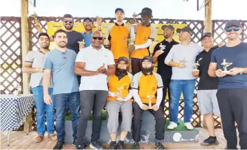  ?? ?? WINNERS PODIUM . . . Members of first-placed Team Harden (centre), second-placed Duracrete (left) and, third placed Team Pitstop display their trophies and medals after the inaugural Duracrete company endurance challenge kart meet at the National Sports Stadium on Saturday