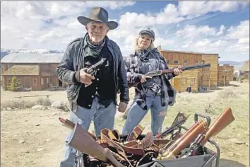  ?? Thell Reed ?? HANNAH GUTIERREZ REED with her armorer father, Thell Reed, on a set. She was armorer and props assistant for “Rust” and is expected to be charged with a felony. Her lawyers call the investigat­ion “f lawed.”