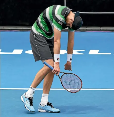  ?? PHOTOSPORT ?? John Isner’s body language says it all as he heads to defeat against fellow American Taylor Fritz.