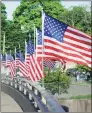  ?? Hearst CT Media file photo ?? American flags are shown on the David N. Theis Memorial Bridge that spans the Mianus Waterway in Greenwich on May 25, 2018. A similar program could be coming to Greenwich Avenue this summer.