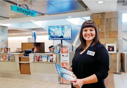  ?? [PHOTO BY JIM BECKEL, THE OKLAHOMAN] ?? Travelers Aid Volunteer Coordinato­r Megan Chapman is near an informatio­n booth inside Will Rogers World Airport.