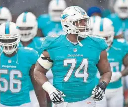  ?? JIM RASSOL/STAFF FILE PHOTO ?? Guard Jermon Bushrod (74) could get pushed for the starting job when training camp rolls around. Depth and health is still an issue on the offensive line.