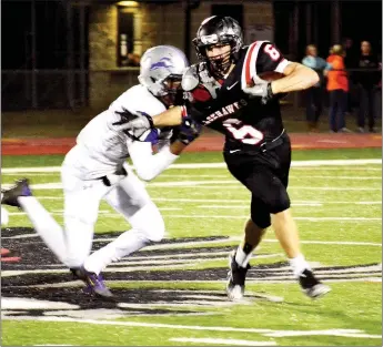  ?? TIMES photograph by Annette Beard ?? Senior Blackhawk Drew Winn (No. 6) had a big night, rushing for 110 yards on 15 carries and scoring two touchdowns. His last carry early in the third quarter put the senior All-Stater over the 2,000 yard mark for the season.