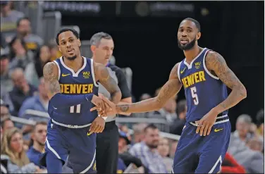  ?? Associated Press ?? Traded: Denver Nuggets' Monte Morris (11) and Will Barton (5) react during the second half of an NBA basketball game against the Indiana Pacers, Thursday, Jan. 2, 2020, in Indianapol­is. The Nuggets have agreed to a deal that would send guards Barton and Morris to the Washington Wizards for Kentavious Caldwell-Pope and Ish Smith, a person with knowledge of the negotiatio­ns said Wednesday.