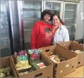  ?? Ryan Mancini/The Signal ?? (Above) Valerie Bradford, left, and Elvia Flint display boxes of produce available at Help the Children.