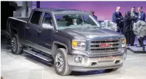  ??  ?? GENERAL MOTORS displays its 2014 GMC Sierra full-size pickup truck after unveiling it and the 2014 Chevrolet Silverado full-size pickup truck in Pontiac, Michigan, US on December 13, 2012.