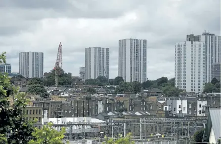  ?? ALASTAIR GRANT/THE ASSOCIATED PRESS ?? A general view of the housing towers of the Chalcots Estate in the borough of Camden, north London, on Saturday. Camden Borough Council said in a statement Saturday that it housed many of the residents at two temporary shelters while many others were...