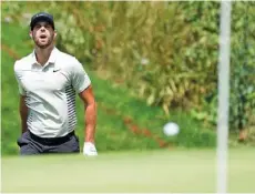  ?? THE ASSOCIATED PRESS ?? Kevin Tway watches the ball bounce toward the hole on the 16th green during the second round of the Canadian Open on Friday in Oakville, Ontario. Tway shot a 68 and led by one stroke.