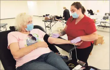  ?? Christian Abraham / Hearst Connecticu­t Media file photo ?? An American Red Cross blood drive in Milford on July 28, 2020. After recent winter weather in Connecticu­t prompted the Red Cross to cancel appointmen­ts for blood donations, officials are urging those able to donate to do so immediatel­y.