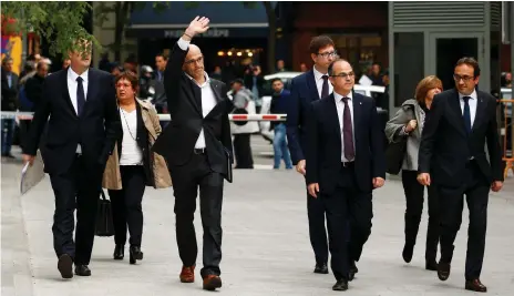  ??  ?? Catalan foreign affairs chief Raul Romeva waves as he arrives with other dismissed cabinet members at Spain’s high court in Madrid after being summoned to face charges of rebellion, sedition and misuse of public funds Reuters