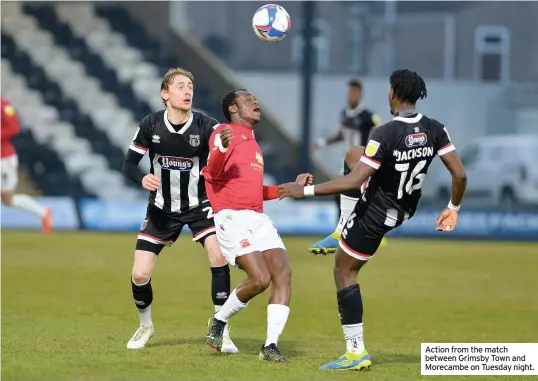  ??  ?? Action from the match between Grimsby Town and Morecambe on Tuesday night.