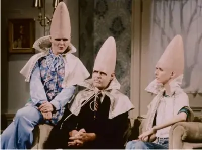  ?? NBC VIA GETTY IMAGES ?? Original “Saturday Night Live” cast members (from left, playing the Coneheads in 1977) Jane Curtin, Dan Aykroyd, and Laraine Newman will be depicted in “SNL 1975,” a movie about the making of the first episode of the show in October 1975.