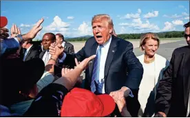  ?? / AP - Evan Vucci ?? President Donald Trump greets supporters after arriving at the Greenbrier Valley Airport in Lewisburg, W.Va., before attending a “Salute to Service” dinner on Tuesday in White Sulphur Springs, W.Va.