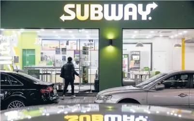  ?? JEAN CHUNG/THE NEW YORK TIMES ?? Subway shops pop with bright colors and serve as the setting for business meetings, social gossip and dates for couples on television shows in South Korea. Above, a Subway restaurant Feb. 11 in Gyoenggido.