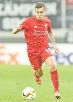  ??  ?? (FILES) This file photo taken on February 19, 2016 shows Liverpool’s Brazilian midfielder Philippe Coutinho playing the ball during the UEFA Europa League Round of 32 football match between FC Augsburg and Liverpool FC in the stadium in Augsburg,...