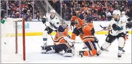  ?? JASON FRANSON — CANADIAN PRESS ?? The Sharks’ Joe Pavelski gets the puck past the Oilers’ Cam Talbot in the first period.