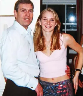  ??  ?? CAUGHT ON CAMERA: Prince Andrew pictured with Virginia Giuffre in 2001