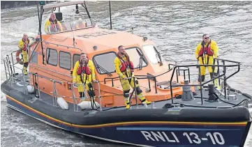  ?? ?? SALUTE: The Montrose lifeboat enters Arbroath to bid farewell to the Inchcape.