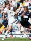  ??  ?? BATTLE: Jason Pearce tussles with Jermaine Beckford