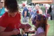  ?? MARIAN DENNIS — MEDIANEWS GROUP ?? Face painting by Rainbow the Clown was one of many activities available Thursday for guests to enjoy during the GoFourth Festival.