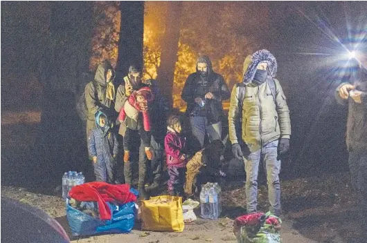  ?? MACIEK NABRDALIK/THE NEW YORK TIMES PHOTOS ?? A police checkpoint this month in the exclusion area near Poland’s border with Belarus. Poland’s government is trying to keep out refugees.