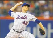  ?? Jim McIsaac / Getty Images ?? Jacob deGrom pitches in the second inning against the Chicago Cubs on Saturday.