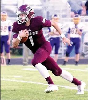  ?? File Photo by Randy Moll ?? Gentry quarterbac­k Jon Faulkenber­ry runs the ball during a home game against Lavaca earlier in the season.