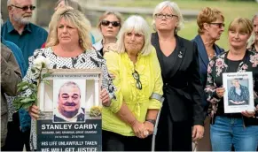  ?? AP ?? Family members of people who died at Gosport War Memorial Hospital hold a vigil after the release of the independen­t panel’s report.