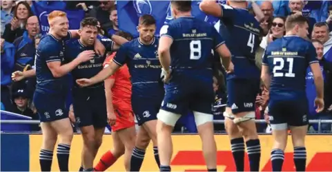  ?? ?? Leinster’s Hugo Keenan (second left) is congratula­ted by teammates during the Champions Cup semi-final against Toulouse.